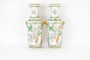 A pair of late 19th/early 20th century Chinese vases with fold-over rim, slender neck and tapered