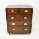 A reproduction brass bound campaign-style chest with two short over three long drawers, raised on