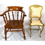 Two modern reproduction chairs, one in Louis XIV style gilt metal, and a captain's chair, possibly