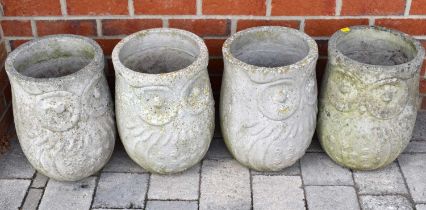 Four concrete owl planters of tapered cylindrical form, height of each 40cm, diameter of each