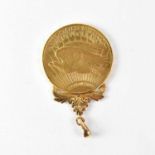 A 1909 gold $20 coin, in pendant mount, approx. 35.6g. Condition Report: The mount has been welded