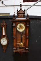 An inlaid Mahogany Vienna wall clock, the ivorine chapter ring set with Roman numerals, height 84cm.