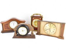 Three modern mantel clocks and a mahogany cased mantel clock with domed top, including a Le Castel