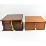 Two coin collectors' tabletop cabinets, comprising a mahogany example with fourteen thin drawers,