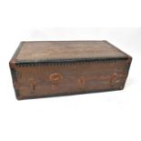 An early 20th century leather stud bound travelling trunk by 'The Non-Breakable Trunk Co. Inc.,