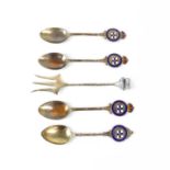 Four silver commemorative spoons and a fork for the Orient Shipping Line, each with enamelled