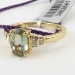 A 14ct gold ring with oval cut claw set pale green gemstone, with six baguette cut diamonds to