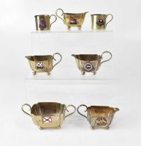 Seven commemorative souvenir silver plated cream jugs for various shipping lines, comprising