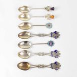 Seven silver commemorative spoons for the Union Castle Shipping Line, two with thistle finials,