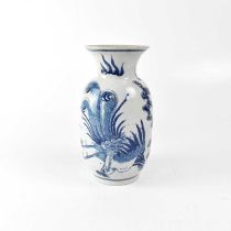 A 19th century Chinese blue and white baluster-form vase painted with phoenixes within clouds,