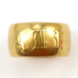 An 18ct gold wide wedding band, size L, width approx. 0.86cm, approx. 8g.