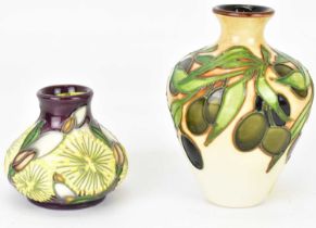 MOORCROFT; a small vase of baluster form, decorated with tube lined olives and branches, height