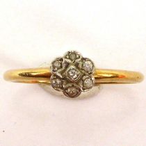 An 18ct gold ring with small diamond floral cluster, size P, approx. 2g.