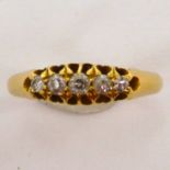 An 18ct gold ring with a row of five graduated diamonds, size L, approx. 2.2g.