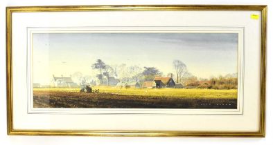 † ALAN INGHAM (1932-2002); watercolour, a long landscape depicting a tractor ploughing a field in