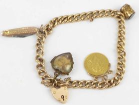 A 15ct gold charm bracelet with four charms, comprising a George IV 1824 half sovereign on 9ct