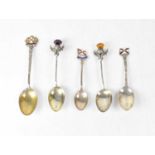 Six silver Royal Mail Shipping Line commemorative spoons, two with thistle finials, and four with