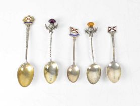 Six silver Royal Mail Shipping Line commemorative spoons, two with thistle finials, and four with