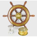 A ship's oak and brass inset wheel, diameter from handle to handle 67cm, unmarked, a Royal Worcester