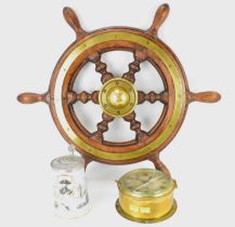 A ship's oak and brass inset wheel, diameter from handle to handle 67cm, unmarked, a Royal Worcester