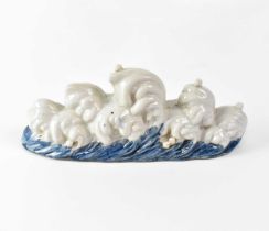 A Chinese blue and white decorated brush rest in the form of waves, unmarked, height 9cm, width