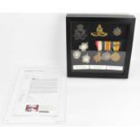 SOUTH AFRICAN CAMPAIGN; a framed display of medals to include Defence, War and 1914-15 Star, cap