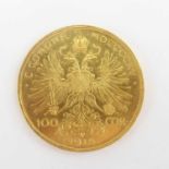 A 1915 Austrian 100 Corona 0.900 fine gold (21ct) coin, 1975 restrike, diameter 36.9mm, 33.96g.