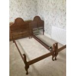 A pair of Edwardian walnut single beds (2). Condition Report: No slats going across the beds but