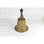 A brass bell from the trawler S.T. Agnes H. Weatherly, dated 1917 Aberdeen, with brass bracket,