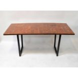 A modern designer steel framed table, the top decorated with inset square tree section veneers, 74 x