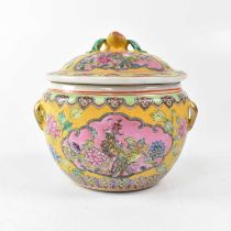 A Chinese Famille Jaune lidded jar, the interior painted with carp, the exterior with cartouches