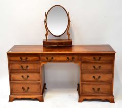 A reproduction yew wood crossbanded and line inlaid nine-drawer kneehole dressing table, 77 x 155