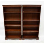 A pair of reproduction mahogany crossbanded and line inlaid open bookcases, the dentil moulded