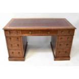 An Edwardian mahogany nine-drawer twin pedestal desk, with tooled oxblood leather inset panel