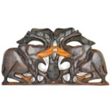 A carved African elephant, wall-mounted frieze or plaque depicting two elephants either side of a