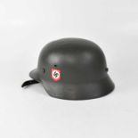 A WWII period German SS helmet, with later internal strap and liner (af). Condition Report: -