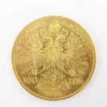 A 1915 Austrian 100 Corona 0.900 fine gold (21ct) coin, 1975 restrike, diameter 36.8mm, 33.96g.