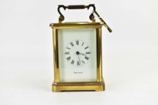 MAPPIN & WEBB; a brass cased carriage clock, the white dial set with Roman numerals, key wind