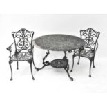 An aluminium garden set comprising pierced circular table, height 73cm, diameter 109cm, and a set of