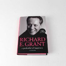 RICHARD E GRANT; a memoir, 'A Pocketful of Happiness', signed to interior. Condition Report: - We