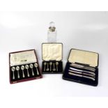 A cased set of six hallmarked silver teaspoons, a further cased set with one spoon missing, a