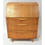 SUTCLIFFE OF TODMORDEN; a mid-20th century teak bureau, with fall front, fitted interior and three
