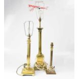 Three brass column table lamps, height of largest 55cm (excluding fitting) (3).