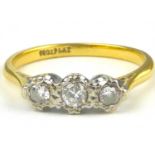 An 18ct gold three-stone diamond ring, the diamonds set in platinum open mounts, size Q, approx. 2.