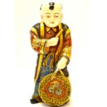 A late 19th/early 20th century Japanese porcelain boy with drum, decorated in the Satsuma manner,