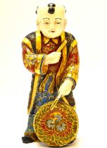 A late 19th/early 20th century Japanese porcelain boy with drum, decorated in the Satsuma manner,