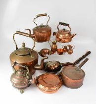 A quantity of copper ware to include four kettles, a saucepan with lid, a bed warming pan and