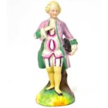 A 19th century Continental porcelain moulded figure of a gentleman holding his tricorne hat, resting