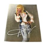 DOLLY PARTON; a promotional picture book bearing the Country artist's signature. Condition Report: -