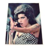 AMY WINEHOUSE; a colour promotional photograph signed 'Tony, love Amy'. Condition Report: - We